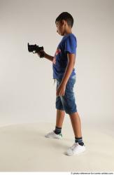 TIMBO STANDING POSE WITH GUN